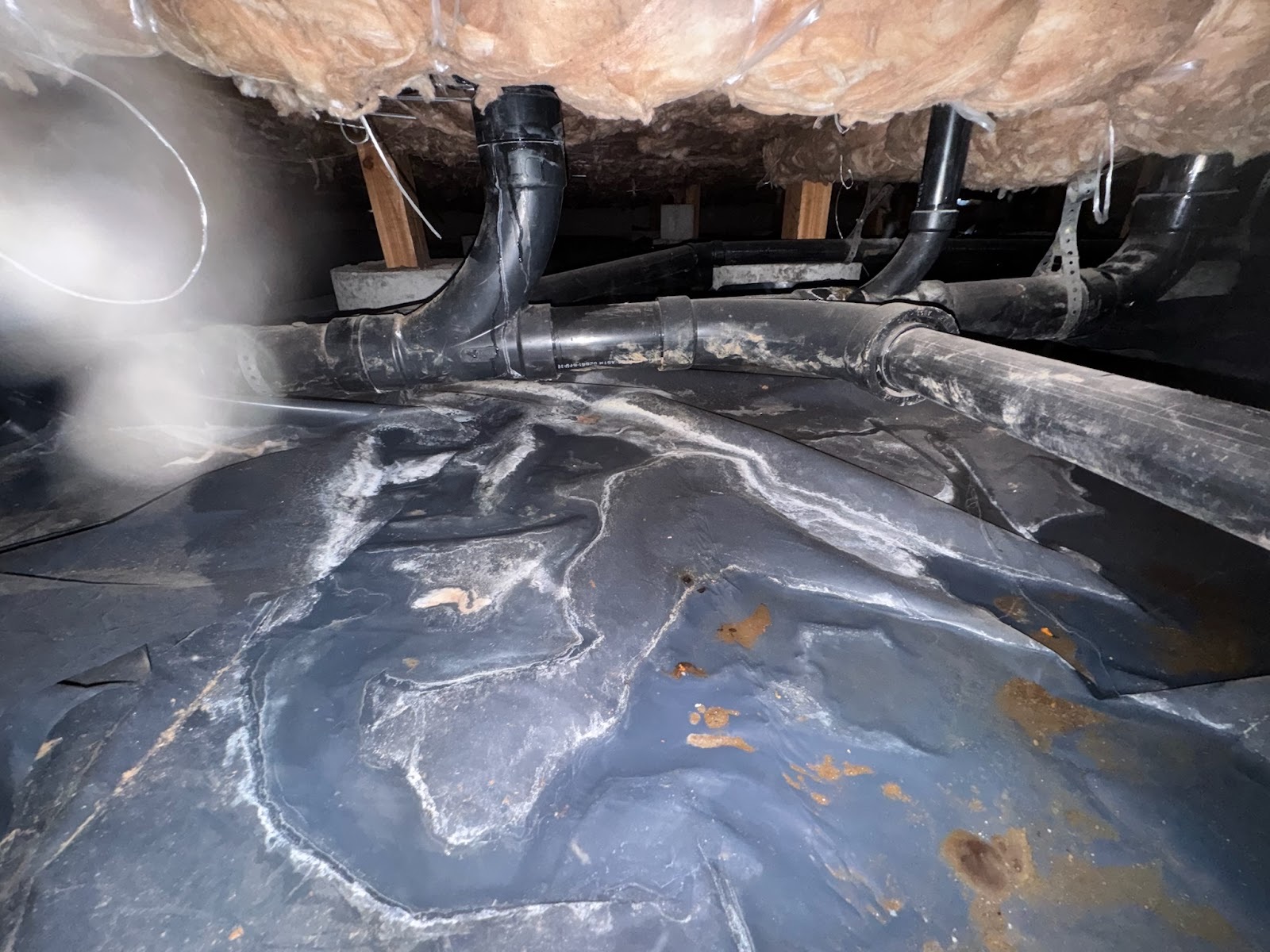 Standing water in a Clark County crawlspace before a sump pump installation